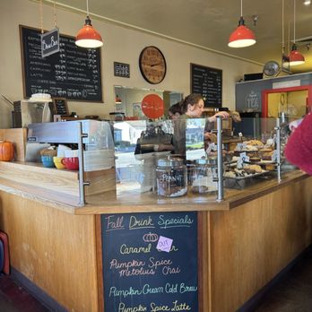 Bookworks - Coffee and baked goods with menus before you get to the counter. Waiting in line. - Bookstores Near Me - Pacific Grove, California