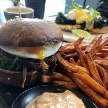 Concrete Jungle - A royally stacked sammie with braised beef, pastrami, provolone & over easy egg held together w/tarragon mayo. With sweet potato fries. - Cafes Near Me - Chippendale, NSW