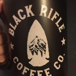a hand holding a coffee mug a hand holding a coffee mug
