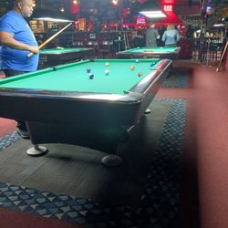 Mr Cue's Billiards II - My bro on the pool table billiards.