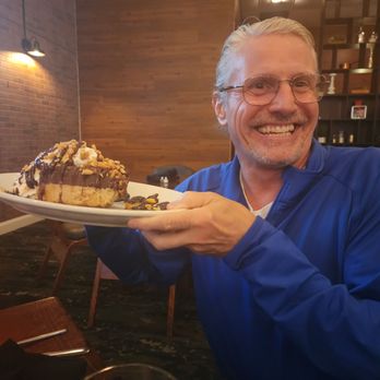 Duke's Tavern - John holding the pie - Coffee & Tea Near Me - Amherst, New York
