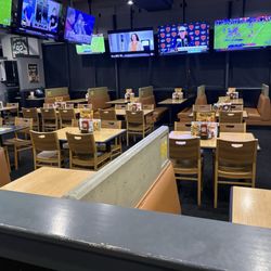 Buffalo Wild Wings - Ask me how and why on a Sunday night that  with the tables this empty it took the team 20 minutes to seat us so we left for Red Robin