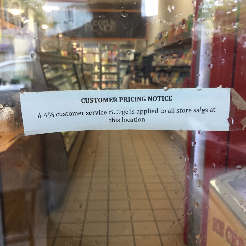 Sign on door of Sean's Place on Job's Lane. They are adding an additional 4% "customer service charge" to all sales. What a ripoff! Sign on door of Sean's Place on Job's Lane. They are adding an additional 4% "customer service charge" to all sales. What a ripoff!
