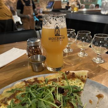 Backcountry Brewing - Prosciutto and Fig pizza (the banging hot sauce) and the Shirley New England IPA. - Pizza Near Me - Squamish, British Columbia