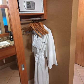 Mirabeau Park Hotel - Closet with robes, safe and luggage rack - Hotels Near Me - Spokane Valley, Washington Mirabeau Park Hotel - Closet with robes, safe and luggage rack - Hotels Near Me - Spokane Valley, Washington