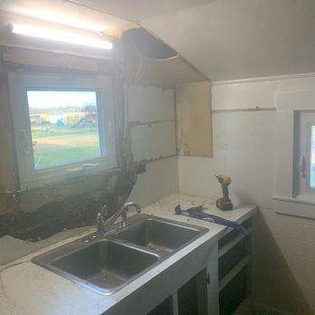 DB Enterprise - This is a before photo of our TINY 9ft by 8ft kitchen. - General Contractors Near Me
