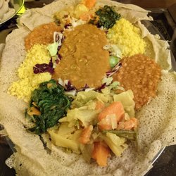 Savana - Vegetarian zighini with shirò (chickpea cream), alicia (vegetables with turmeric), hamli (herbs), tumtumó (lentils with berbere), cous cous