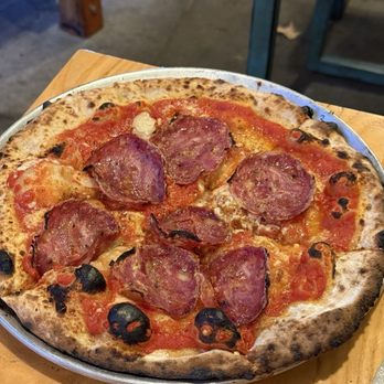 Pinyon - Porco rosso $22 - Spicy Tomato Sauce, Pecorino Cheese, Soppressata, Breadcrumb, Confit garlic (9/12/25) - Pizza Near Me - Ojai, California