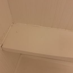 Shelf in shower falling off.