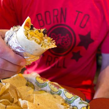 Moe's Southwest Grill - a man eating a burrito - Tex-Mex Near Me - Bronx, New York Moe's Southwest Grill - a man eating a burrito - Tex-Mex Near Me - Bronx, New York