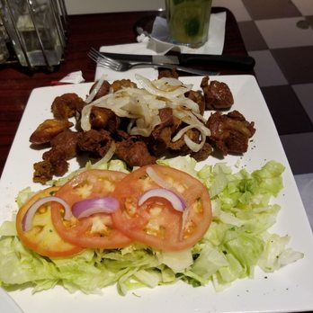Costa Azul - Carne frita con cebolla (fried port meat with onions) - Peruvian Near Me - Carolina, Puerto Rico Costa Azul - Carne frita con cebolla (fried port meat with onions) - Peruvian Near Me - Carolina, Puerto Rico