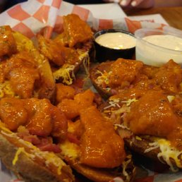 Buffalo chicken potato skins with a side of ranch. Huge portion! Buffalo chicken potato skins with a side of ranch. Huge portion!