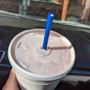 Webster's Country Burger Drive-In - a hand holding a plastic cup with a blue straw - Burgers Near Me - Clements, California Webster's Country Burger Drive-In - a hand holding a plastic cup with a blue straw - Burgers Near Me - Clements, California