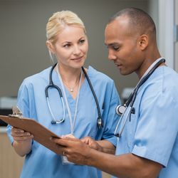 RWJ University Hospital Hamilton - A pair of doctors discussing a patient's condition.