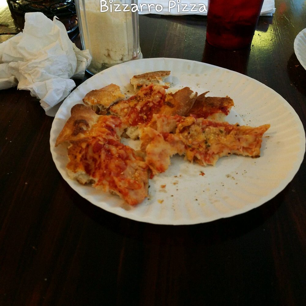 Bizzarro Pizzeria - I had to pick at the  slice to get a bit - Pizza Near Me - Palm Bay, Florida