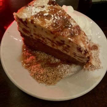 Roman Cucina - Butterfinger Cheesecake (beautiful but not a super desirable flavor) - Italian Near Me - Dallas, Texas Roman Cucina - Butterfinger Cheesecake (beautiful but not a super desirable flavor) - Italian Near Me - Dallas, Texas