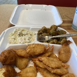 Fried shrimp with coleslaw and fried okra.