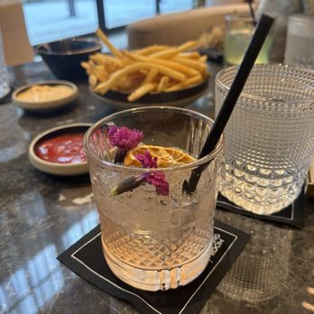Windsor Arms Hotel - a glass of water and a plate of fries - Canadian (New) Near Me - Toronto, Ontario Windsor Arms Hotel - a glass of water and a plate of fries - Canadian (New) Near Me - Toronto, Ontario