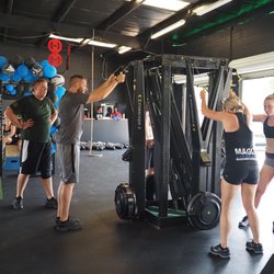 Palm Harbor Strength & Conditioning - The ski machine is a great workout for your arms and core.