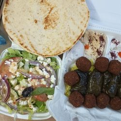 Stop To Shop - Veggie Plate. Salad, 1 pita, hummus, tahini sauce, rice, grape leaves, falafel