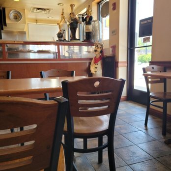 Gigio's Pizzeria - a dog sitting in a chair - Pizza Near Me - Des Plaines, Illinois Gigio's Pizzeria - a dog sitting in a chair - Pizza Near Me - Des Plaines, Illinois