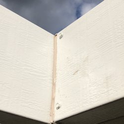 Backyard and Home - Beige caulking for a white patio