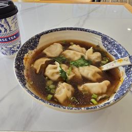 Pork and corn dumplings in soup. Hand punched lemon tea. Pork and corn dumplings in soup. Hand punched lemon tea.
