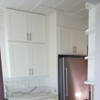 OCG Building Supply - White Shaker cabinets , custom made to go to ceiling , and a custom fit around the refrig. River White quartz countertop . - Cabinetry Near Me - Honolulu, Hawaii