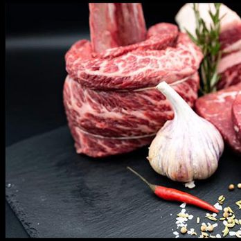 Harry's Natural Meats - raw meat on a black plate - Meat Shops Near Me - Calgary, Alberta Harry's Natural Meats - raw meat on a black plate - Meat Shops Near Me - Calgary, Alberta
