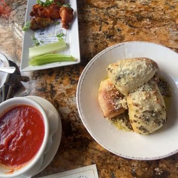 Tomatina - Roasted Chicken Wings, Tomatinas Signature Garlic Rolls, Cheese Ravioli - Italian Near Me - Roseville, California Tomatina - Roasted Chicken Wings, Tomatinas Signature Garlic Rolls, Cheese Ravioli - Italian Near Me - Roseville, California