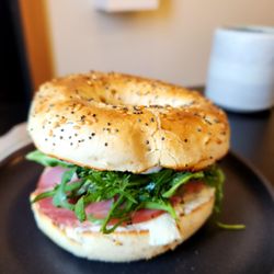 The Colombian Coffee Bar and Roastery - The breakfast bagel for $10.00 in 2023. It's definitely delicious but also very messy.