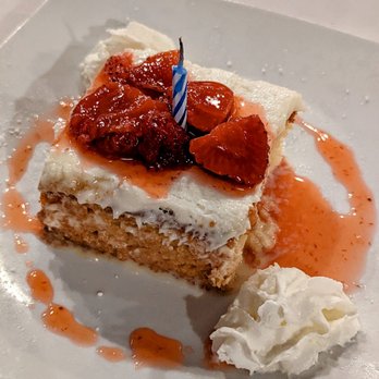 Galo Tavern 18 - Tres Leches cake topped with strawberries - Steakhouses Near Me - New Hyde Park, New York Galo Tavern 18 - Tres Leches cake topped with strawberries - Steakhouses Near Me - New Hyde Park, New York