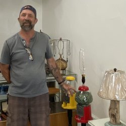 Out Of The Dark - The owner, showing a gum ball machine lamp.
