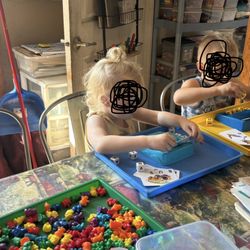 Donna's Learning Center - Children working with letters and words