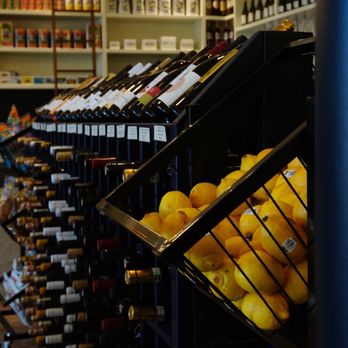 Dada Market - shelves of wine and oranges - Grocery Near Me - Los Angeles, California