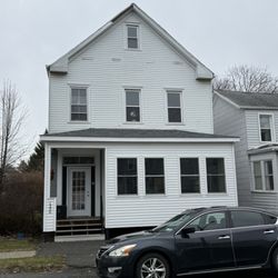 Capital Diamond Roofing - Prior to replacement. Missing 5ft. section of fascia at the peak of the third floor.