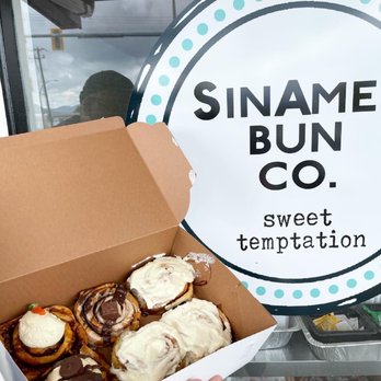 Sinamen Bun - a person holding a box of donuts - Bakeries Near Me - Chilliwack, British Columbia