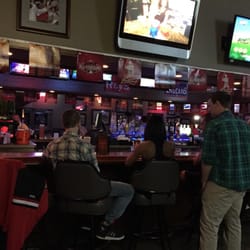 Legends Sports Pub & Grille - Bar scene with booths for family's before 9.
