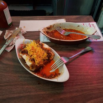 Chili John's - Half a chili dog and what's left oh some chilaquiles. A little oily but that's where all the flavor lies. - American Near Me - Burbank, California