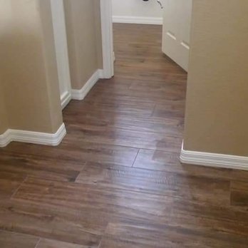 Independent Tile - Laminate wood and baseboard - Flooring Near Me Independent Tile - Laminate wood and baseboard - Flooring Near Me