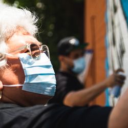 George Floyd Mural - Mural artist Donkeemom working alongside son and fellow mural artists Donkeeboy | Photo: David 'Odiwams' Wright