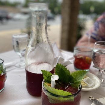 Nova Europa Restaurant - a table with a pitcher of wine and a glass of water - Portuguese Near Me - Silver Spring, Maryland Nova Europa Restaurant - a table with a pitcher of wine and a glass of water - Portuguese Near Me - Silver Spring, Maryland