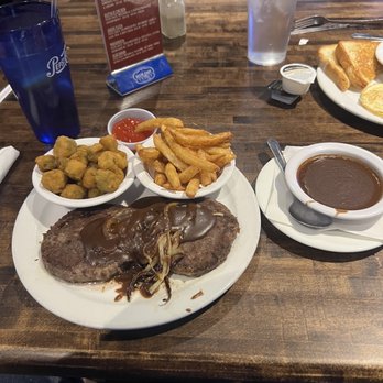 High Park Bar & Grill - Hamburger steak with onions and gravy with sides of okra and fries. - Sports Bars Near Me - Raleigh, North Carolina