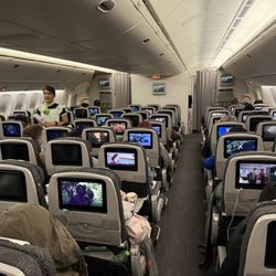 This Boeing 777-300ER had a bit tighter 31" seat pitch with the standard 3 x 3 x 3 layout.