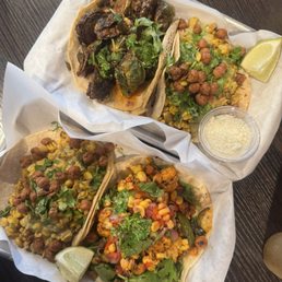 Top tacos Brussels sprouts and elote bottom photo elote and maha tacos Top tacos Brussels sprouts and elote bottom photo elote and maha tacos
