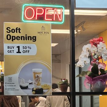 Micha Boba Tea Bar - Picture of their window where their ad about their soft opening special was posted. - Juice Bars & Smoothies Near Me - Stanton, California