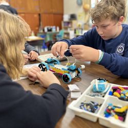Saint Brigid Academy - Our students are assembling a robotic vehicle during STEAM class.