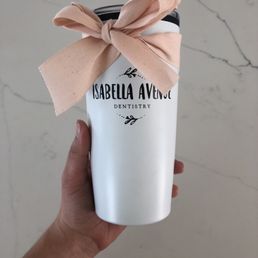 Cute travel mug with a drawstring bag rolled up inside!