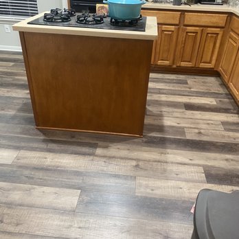 Flooring Warehouse - In our kitchen. We are in the process of getting new countertops and painting cabinets, but this area used to be outdated tile. - Flooring Near Me - Cedar Park, Texas Flooring Warehouse - In our kitchen. We are in the process of getting new countertops and painting cabinets, but this area used to be outdated tile. - Flooring Near Me - Cedar Park, Texas