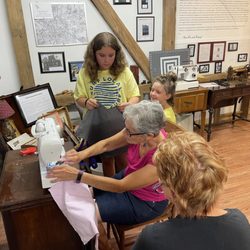 Teaching Museum for the Fiber Arts and Textiles - Learning to sew on our Singer sewing machines